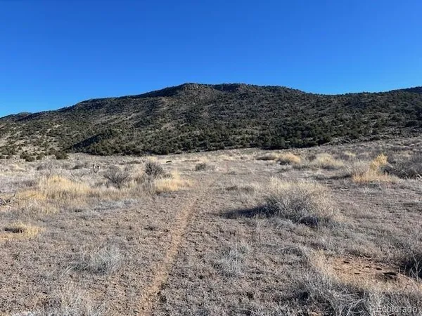 a view of mountain view with mountains in the background