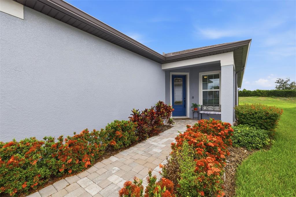10462 Spring Tide Way Palmetto, FL 34221 - Photo 20 of 21 a front view of a house with garden