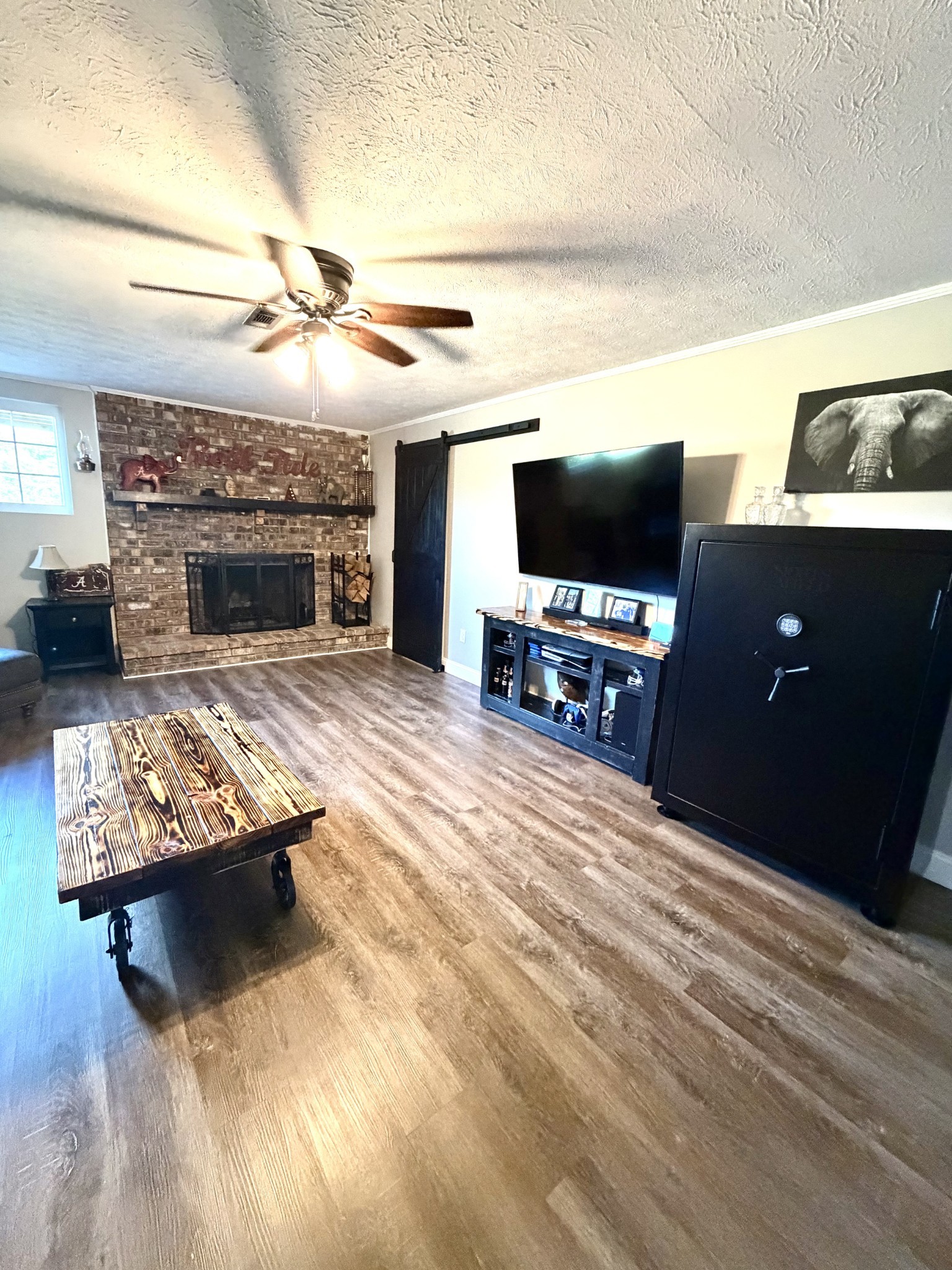356 Lee Road Cottontown, TN 37048 - Photo 31 of 52 a living room with furniture and a fireplace