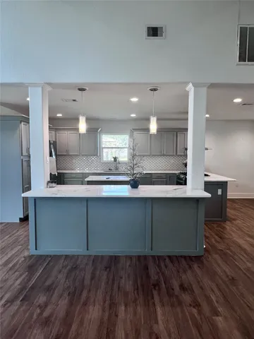 a view of kitchen with wooden floor