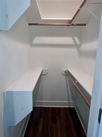 a view of an empty walk in closet