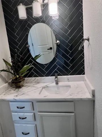 a view of wooden floor and windows in a room