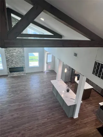 a view of a balcony with wooden floor