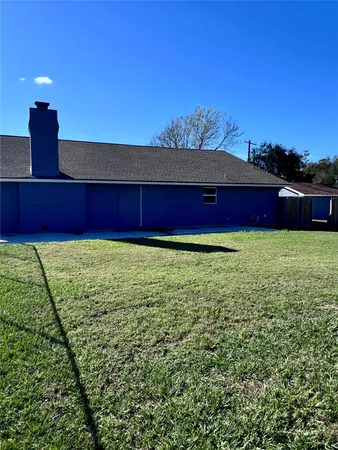 a view of a pool with a yard