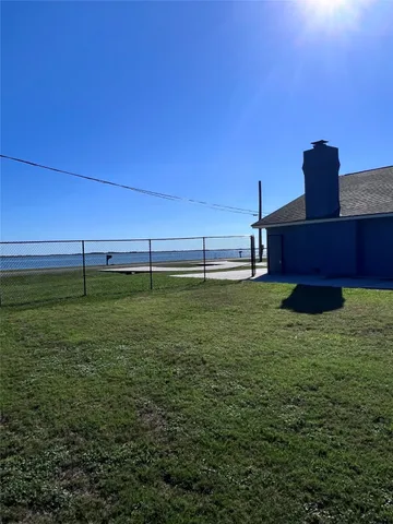 a view of an outdoor space and basketball court