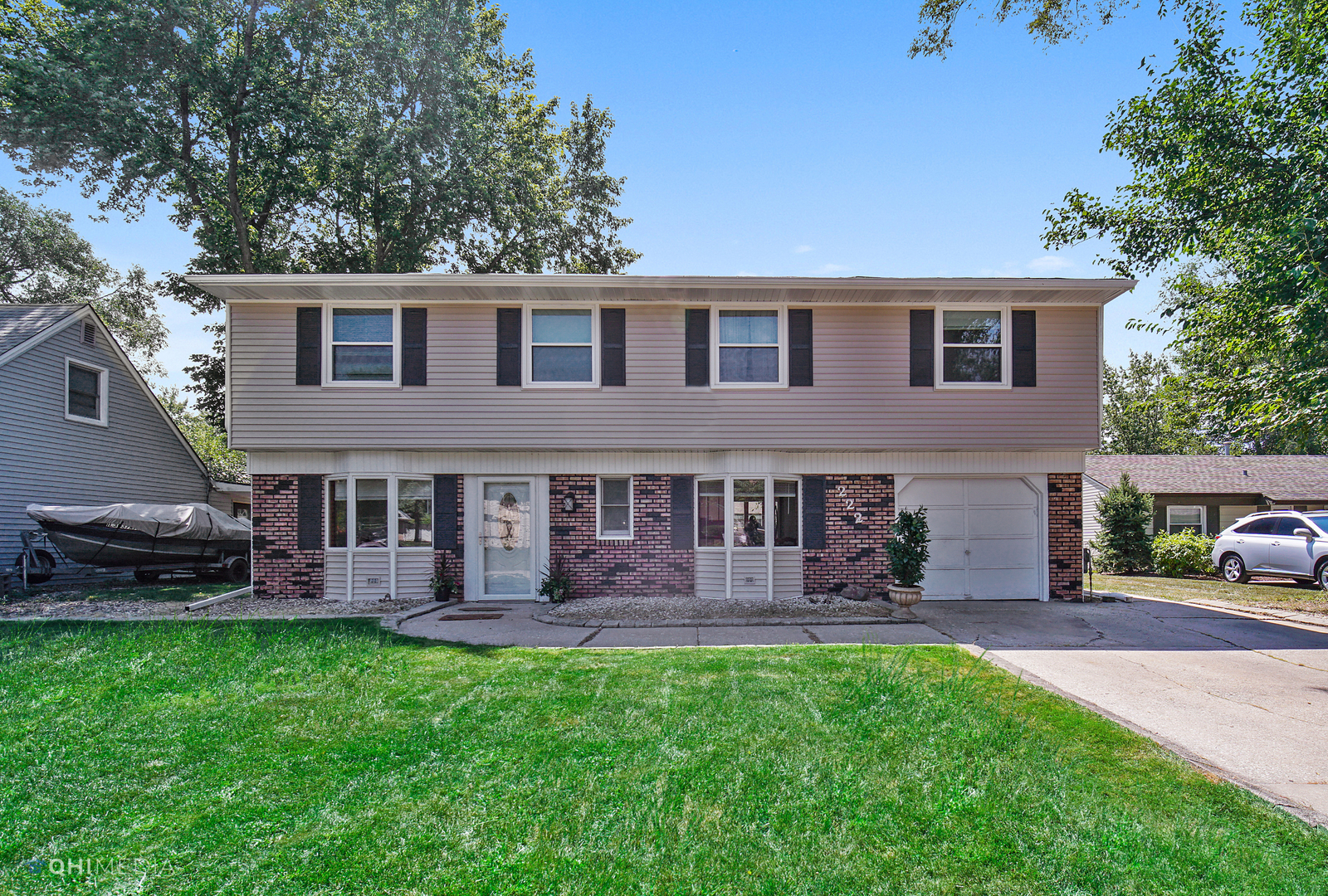 222 Thornhurst Road Bolingbrook, IL 60440 - Photo 1 of 22 a front view of a house with garden and porch