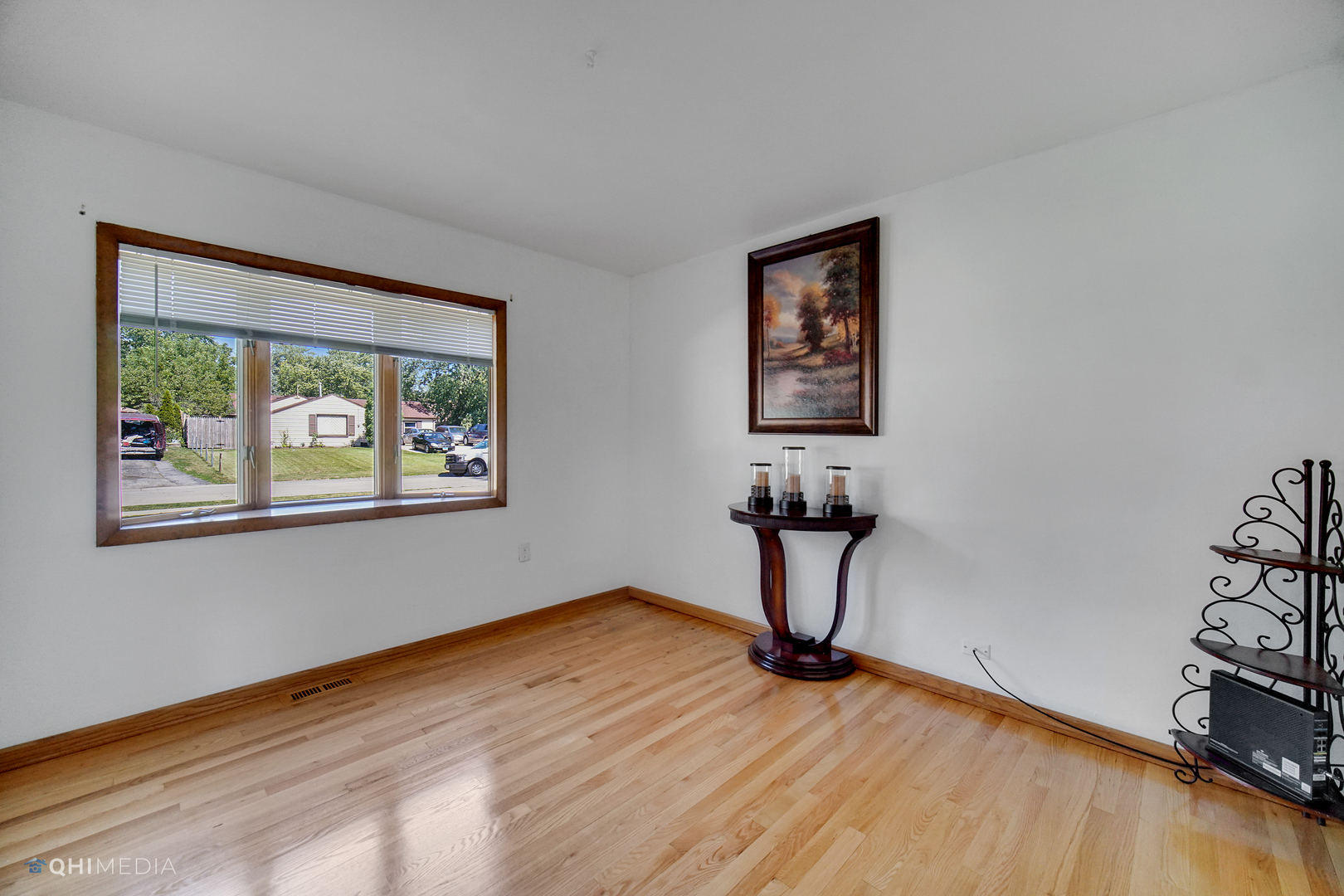 222 Thornhurst Road Bolingbrook, IL 60440 - Photo 11 of 22 a view of a livingroom with wooden floor and a window