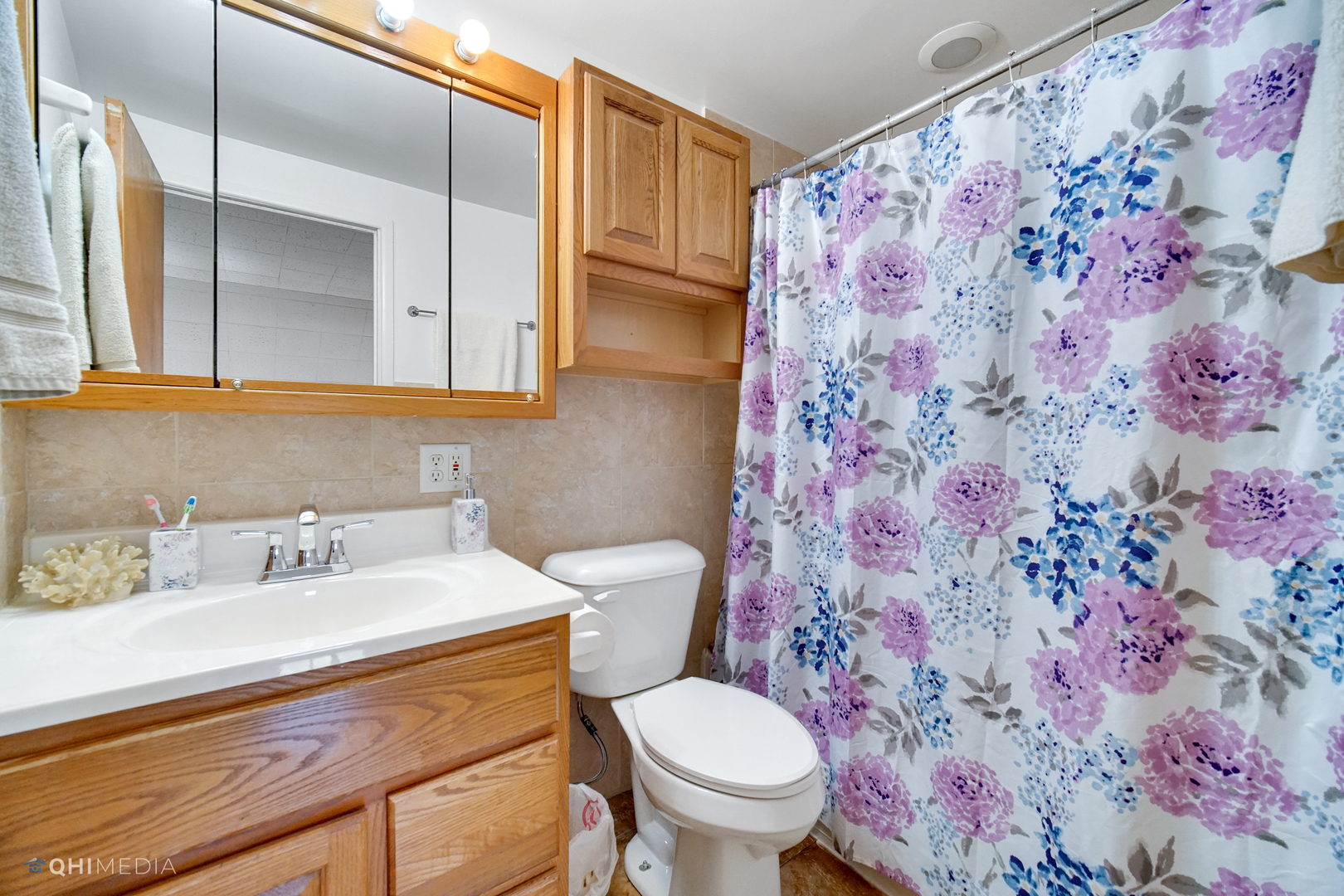 222 Thornhurst Road Bolingbrook, IL 60440 - Photo 16 of 22 a bathroom with a sink toilet and a mirror