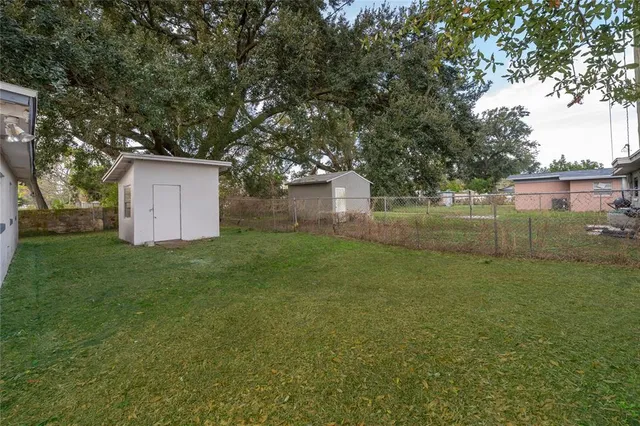 a backyard of a house with lots of green space