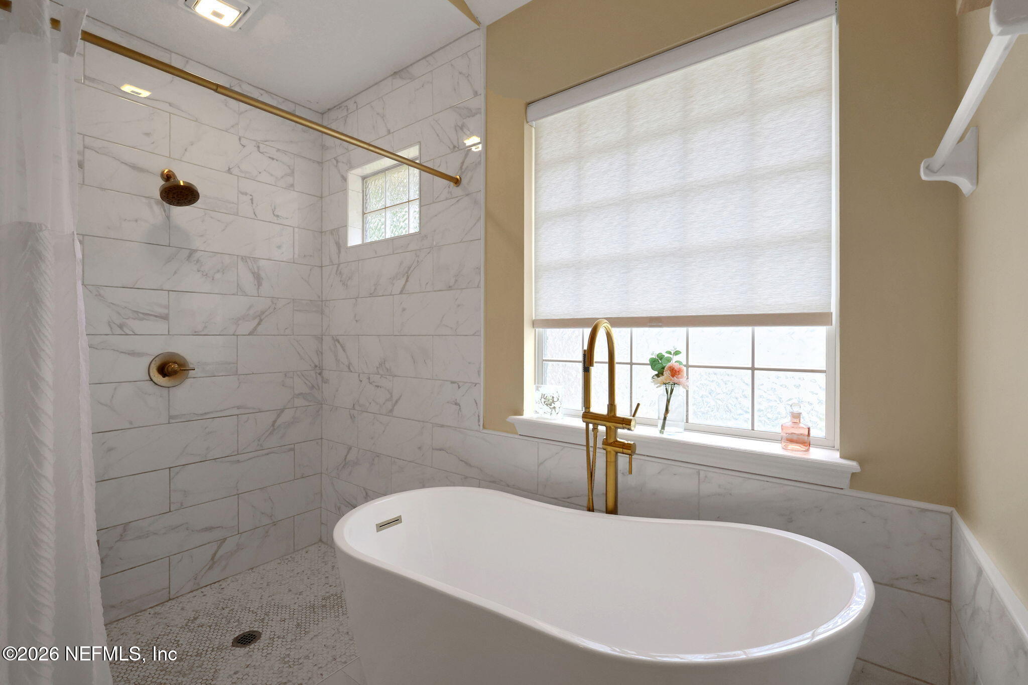 4320 Rye Court St. Johns, FL 32259 - Photo 35 of 60 a bathroom with a bathtub and shower