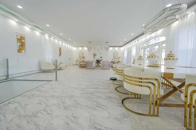 a room with lots of chairs and mirrors