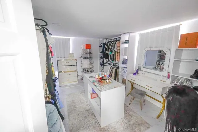 a utility room with cabinets dryer and washer