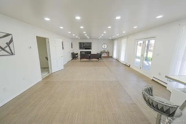 a view of a livingroom with furniture and windows