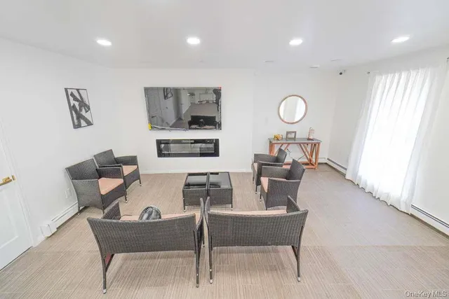 a dining room with furniture and window