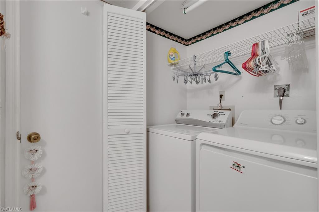 1025 Foxfire Lane, Unit 110 Naples, FL 34104 - Photo 26 of 48 a bathroom with a sink and a mirror