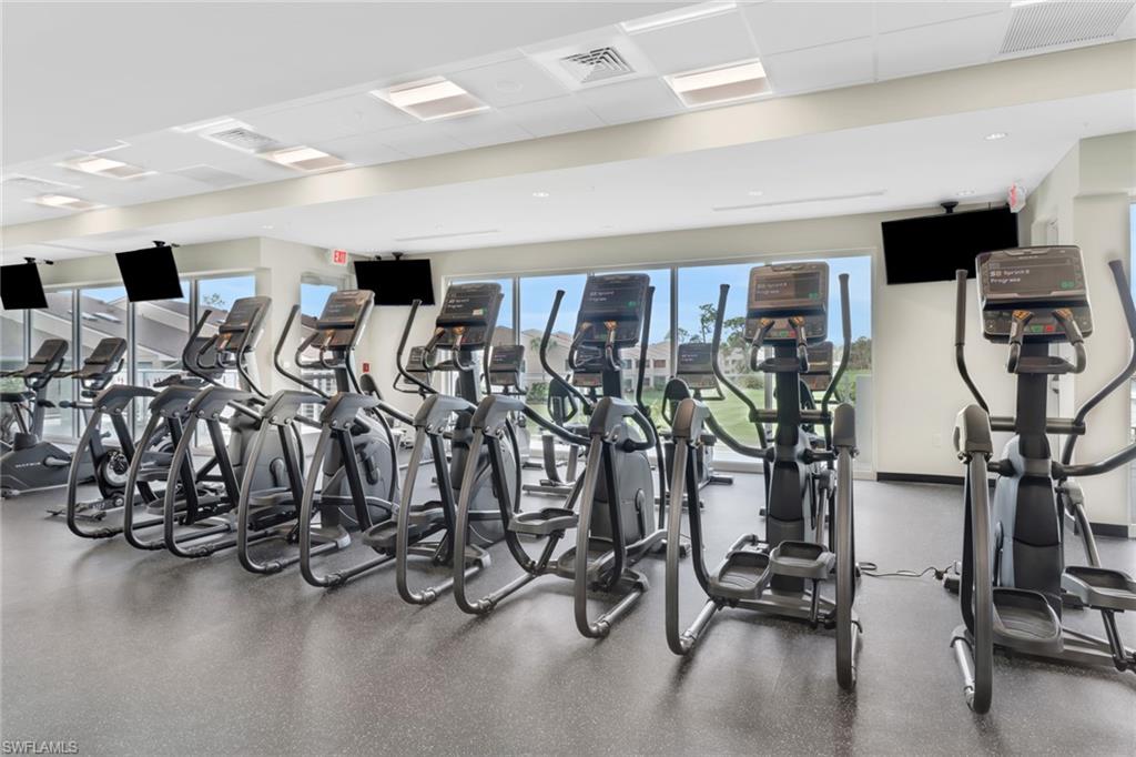 1025 Foxfire Lane, Unit 110 Naples, FL 34104 - Photo 41 of 48 a view of a room with gym equipment