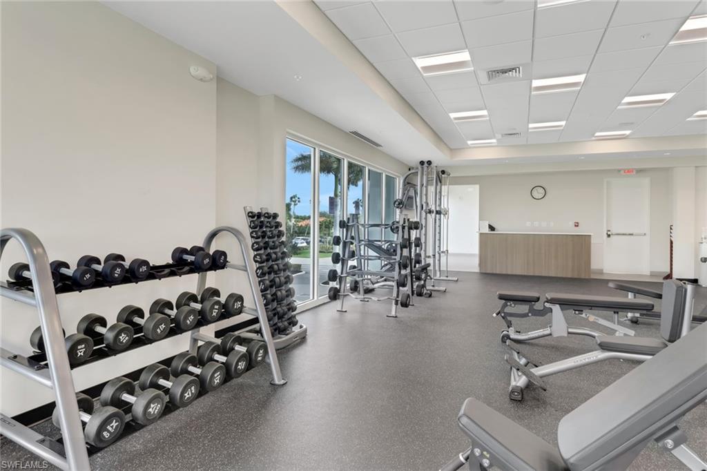 1025 Foxfire Lane, Unit 110 Naples, FL 34104 - Photo 43 of 48 a view of a room with gym equipment