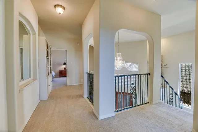 a view of a hallway view with three rooms