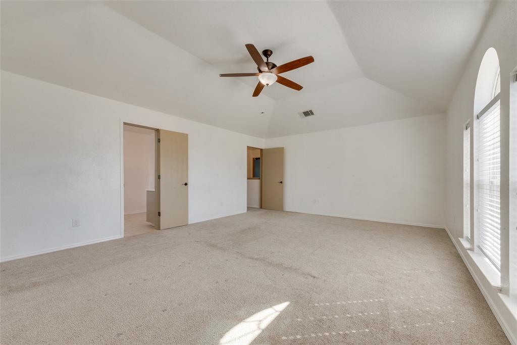2701 Wildridge Court Fort Worth, TX 76108 - Photo 13 of 26 a view of a livingroom with a ceiling fan and window