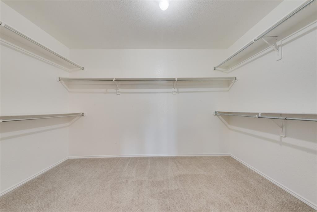 2701 Wildridge Court Fort Worth, TX 76108 - Photo 16 of 26 a view of an empty walk in closet