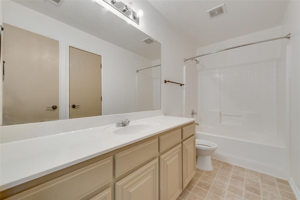 2701 Wildridge Court Fort Worth, TX 76108 - Photo 18 of 26 a bathroom with a sink a toilet and shower