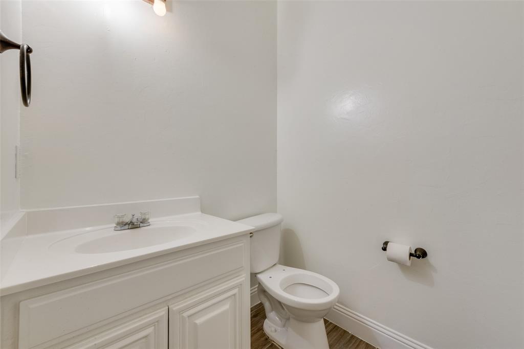 2701 Wildridge Court Fort Worth, TX 76108 - Photo 21 of 26 a bathroom with a sink and a toilet