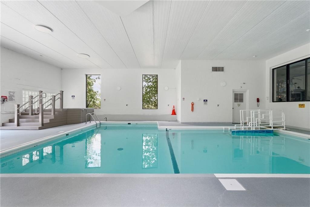 5600 Munhall Road, Unit 504 Pittsburgh, PA 15217 - Photo 36 of 41 Indoor pool and jacuzzi with a sun deck right outside.
