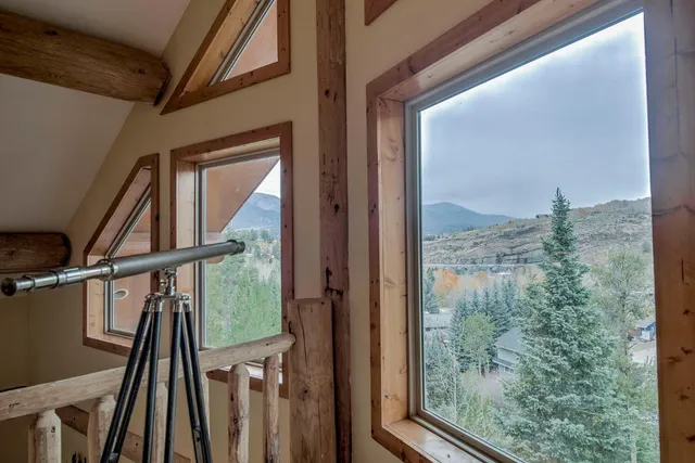 a view of a balcony with wooden floor and door