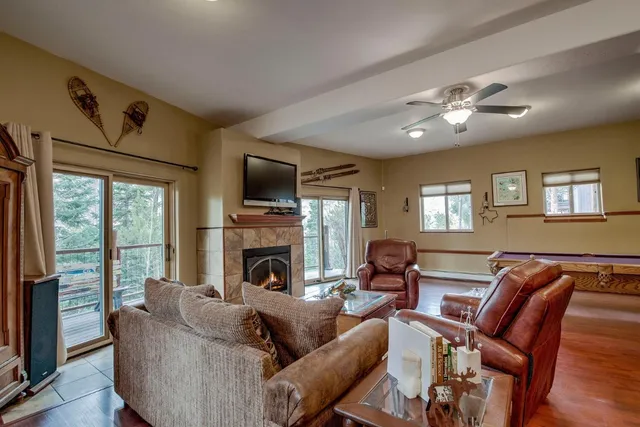 a living room with furniture fireplace and a flat screen tv