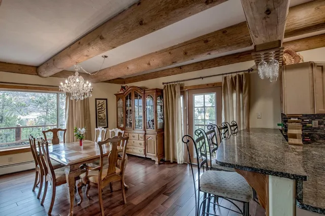 a view of a dining room with furniture window and outside view