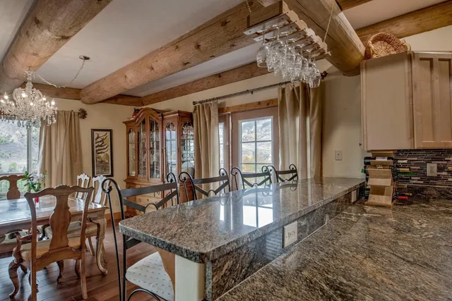 a room with lots of table and chairs