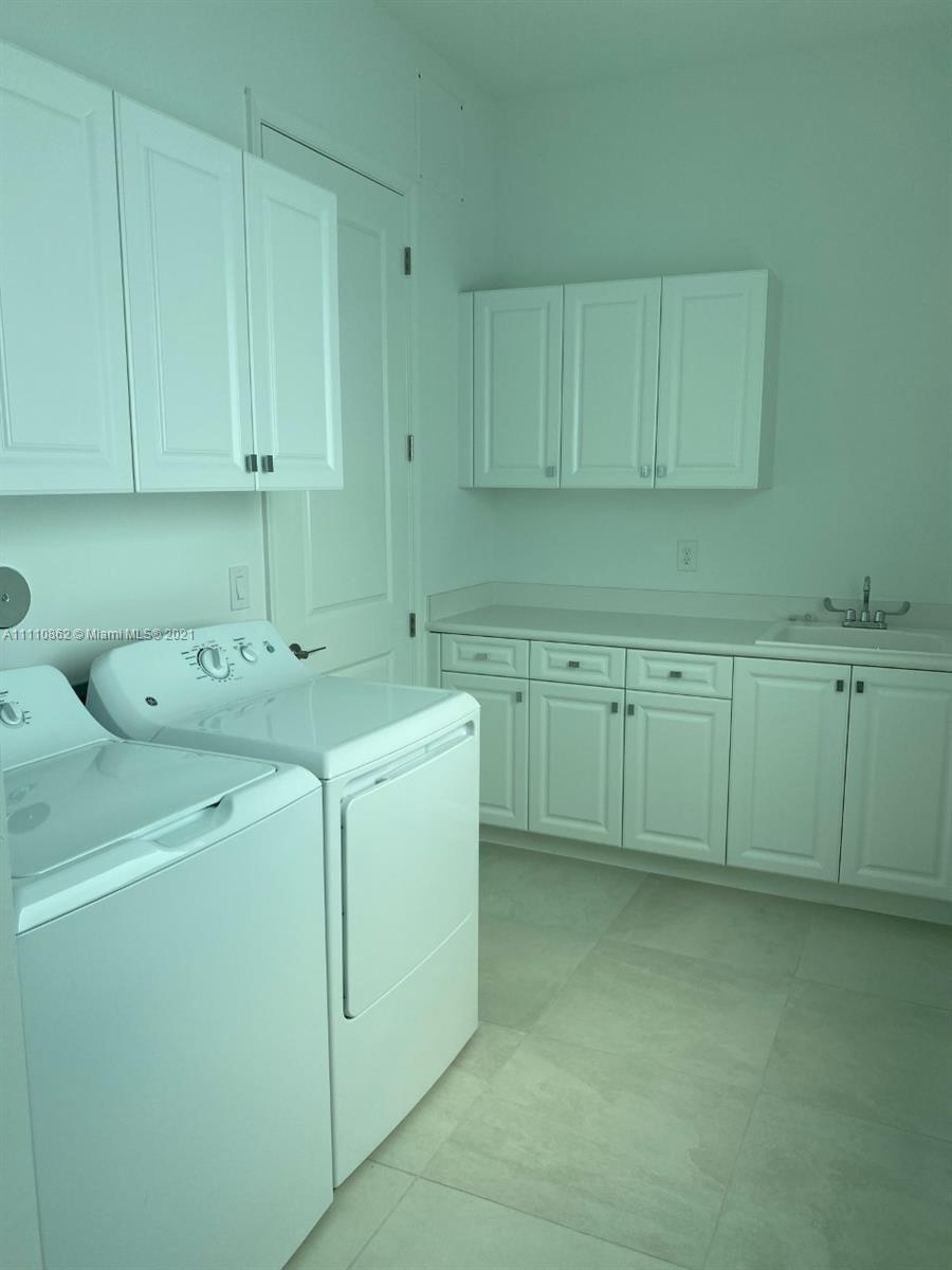 Polo Trace Delray Beach, FL 33446 - Photo 11 of 40 a utility room with a sink
