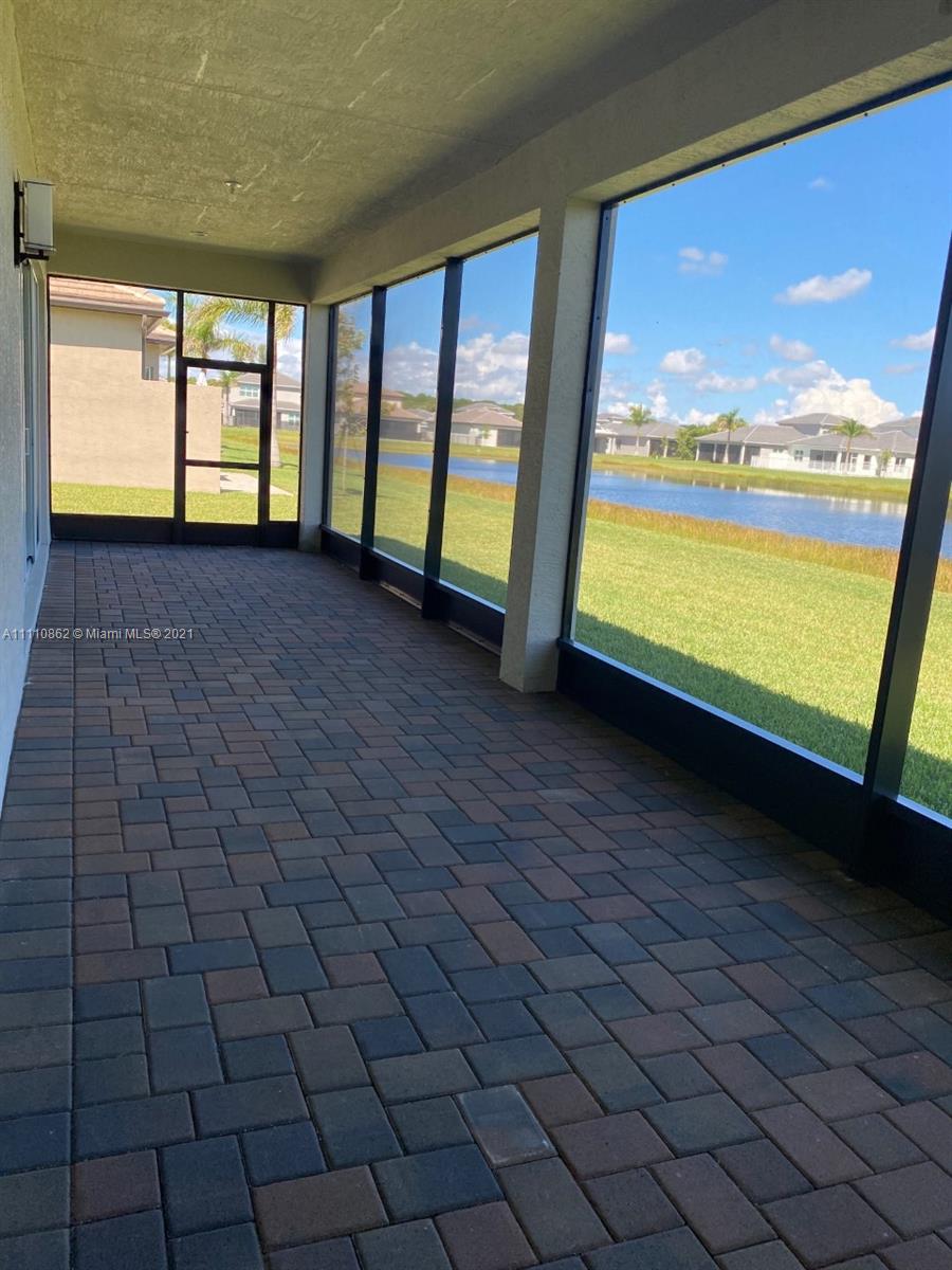 Polo Trace Delray Beach, FL 33446 - Photo 15 of 40 wooden floor in an empty room with a window