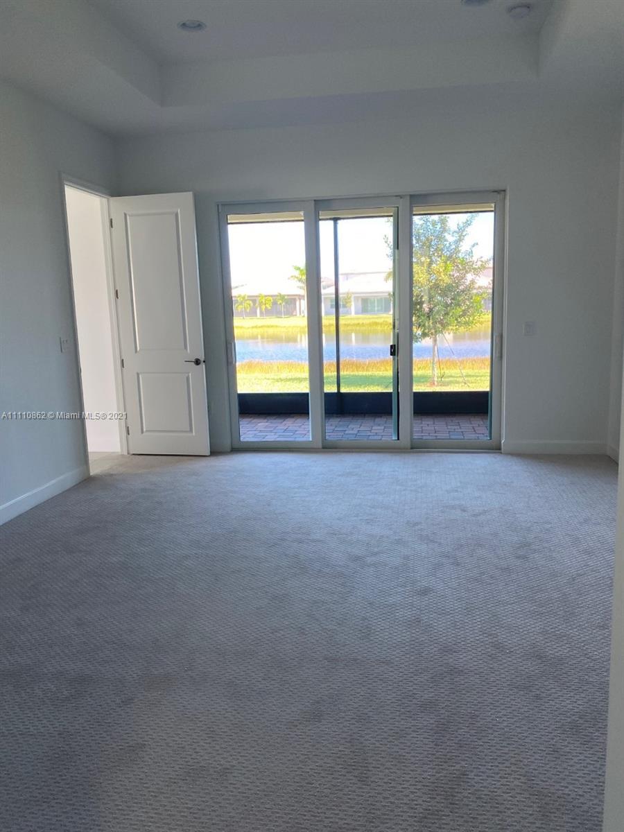 Polo Trace Delray Beach, FL 33446 - Photo 17 of 40 a view of an empty room with a window