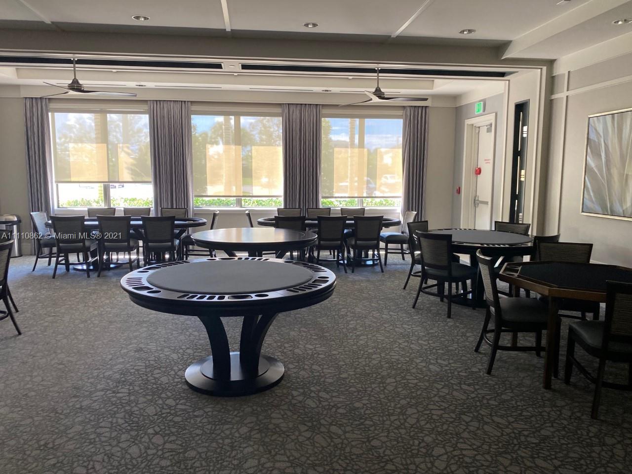 Polo Trace Delray Beach, FL 33446 - Photo 32 of 40 a living room with furniture a window and chairs