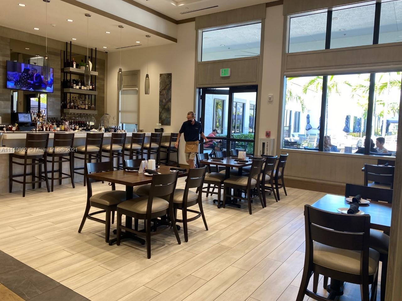 Polo Trace Delray Beach, FL 33446 - Photo 37 of 40 a view of a dining room with furniture window and wooden floor