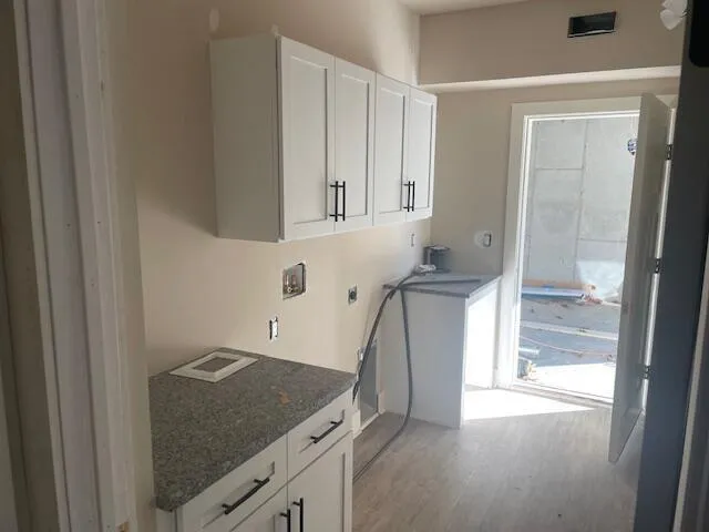 a kitchen with a sink and a refrigerator