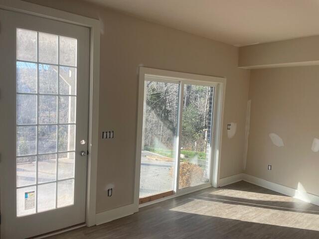 5017 Merriman Road Roanoke, VA 24018 - Photo 4 of 7 a view of a room with wooden floor and windows