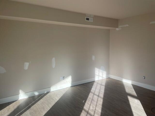 5017 Merriman Road Roanoke, VA 24018 - Photo 5 of 7 a view of a room with wooden floor and white walls