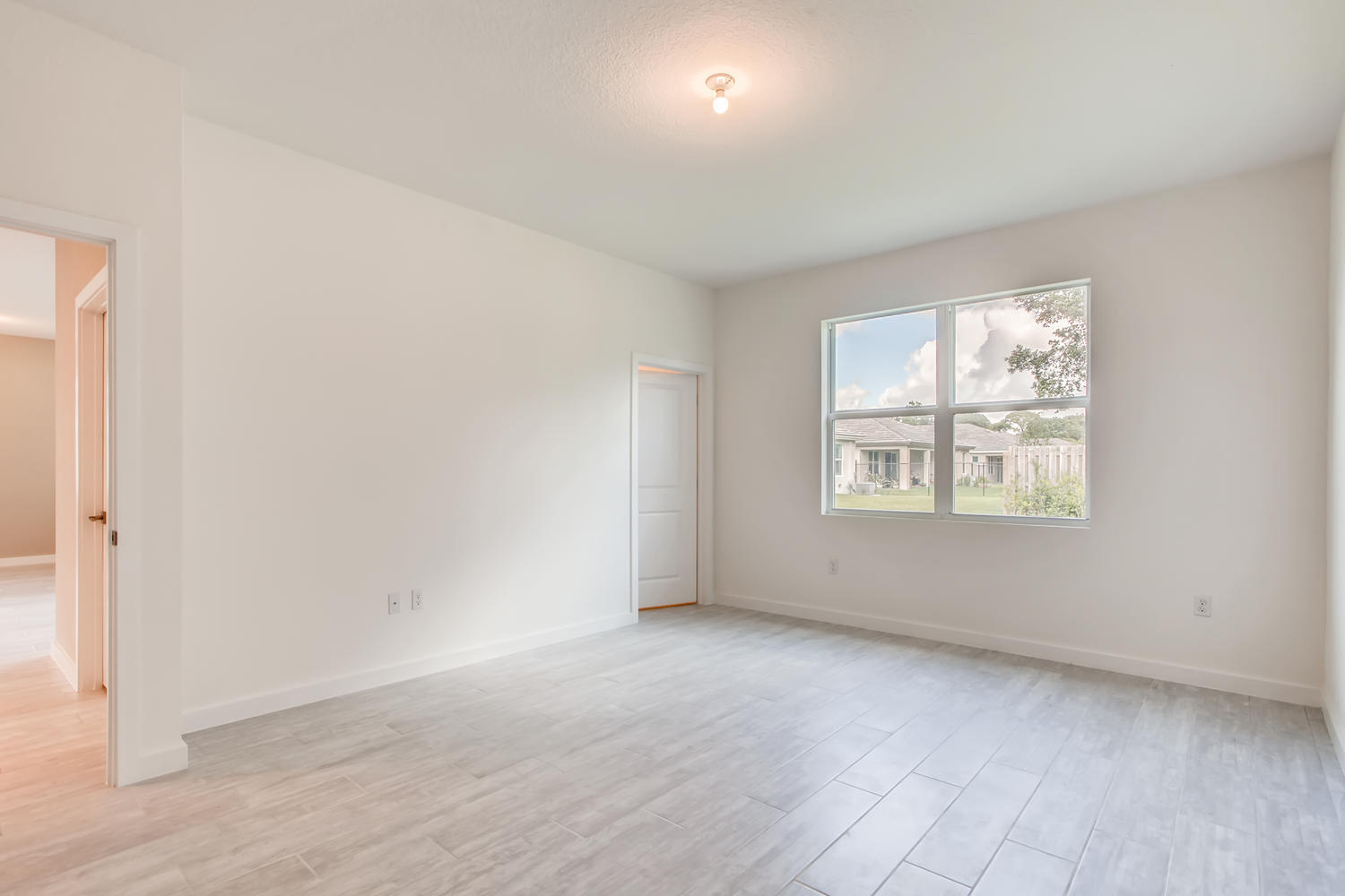 2173 Southwest Raspberry Place Palm City, FL 34990 - Photo 12 of 18 Clifton-large-011-011-Master Bedroom-150