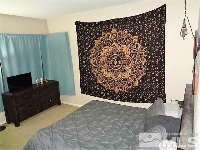 5555 Tappan Drive Reno, NV 89523 - Photo 11 of 11 a bed room with a bed and a black chair