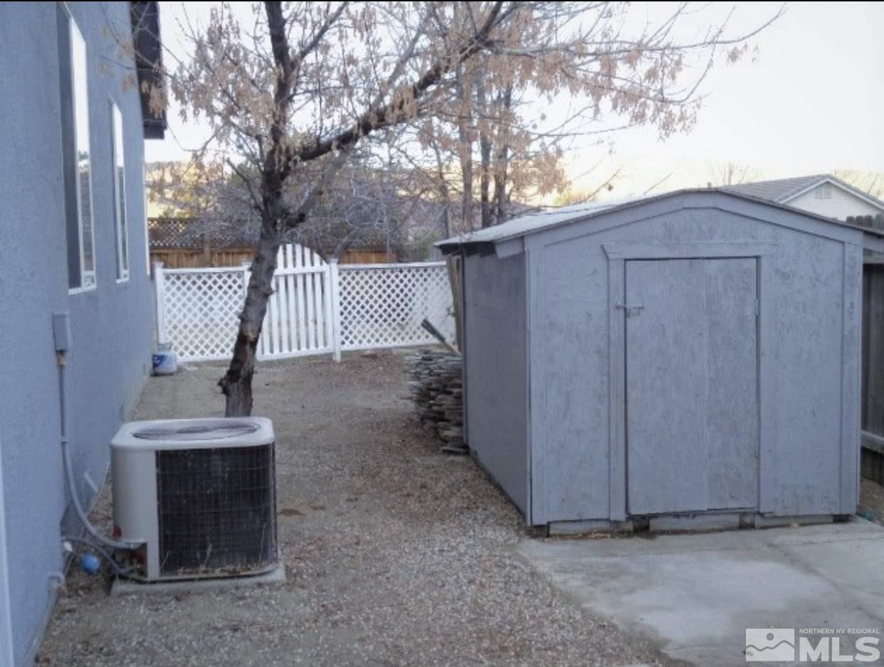 5555 Tappan Drive Reno, NV 89523 - Photo 6 of 11 a view of backyard with cabin and wooden fencing