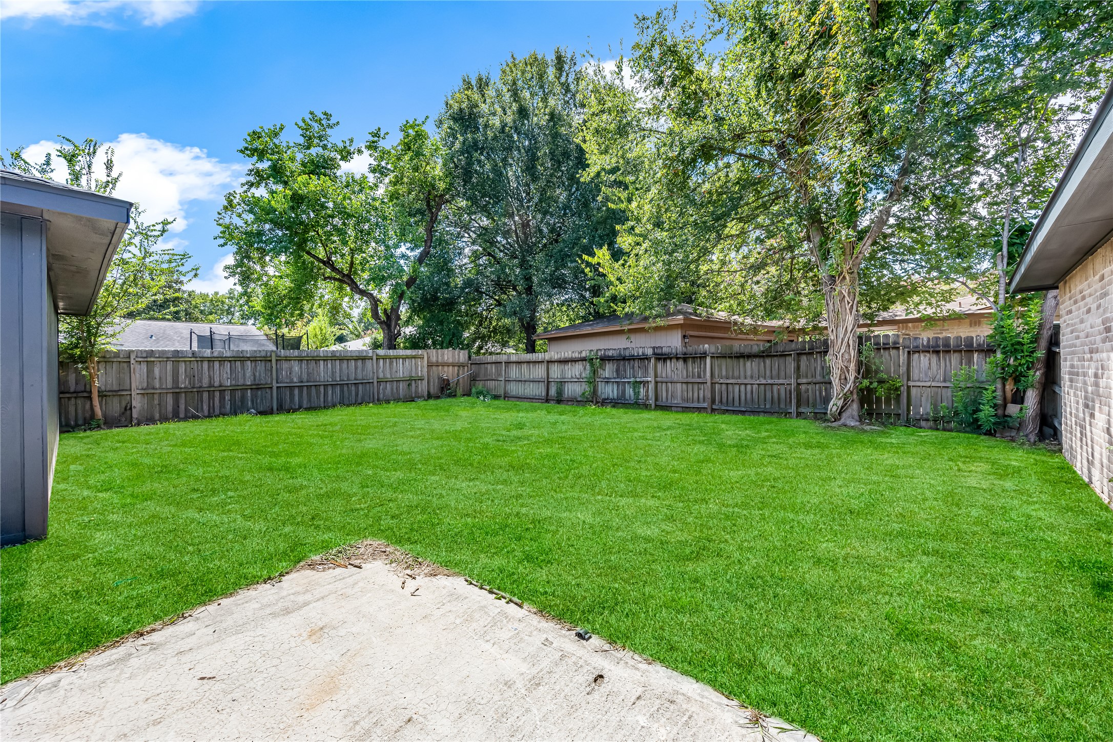 4534 Rosegate Drive Spring, TX 77373 - Photo 23 of 24 The open yard offers plenty of room for outdoor entertaining or creating your own relaxing backyard retreat.