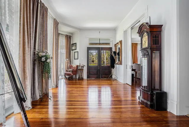 a living room with fireplace furniture and a flat screen tv