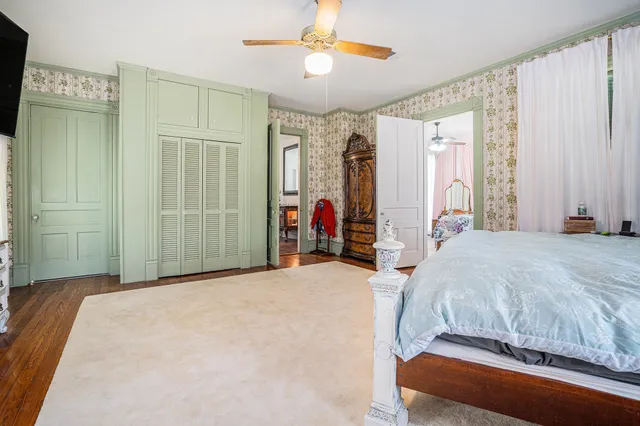 a room with refrigerator and table