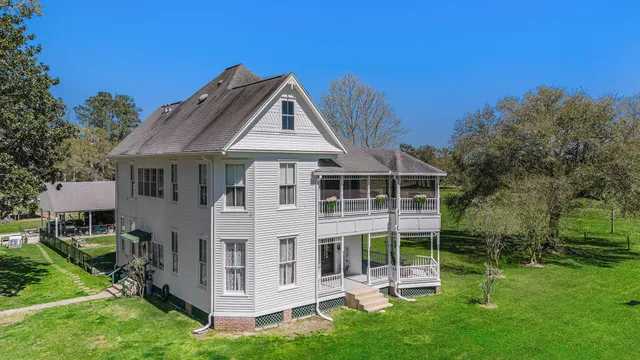 a aerial view of a house with a big yard