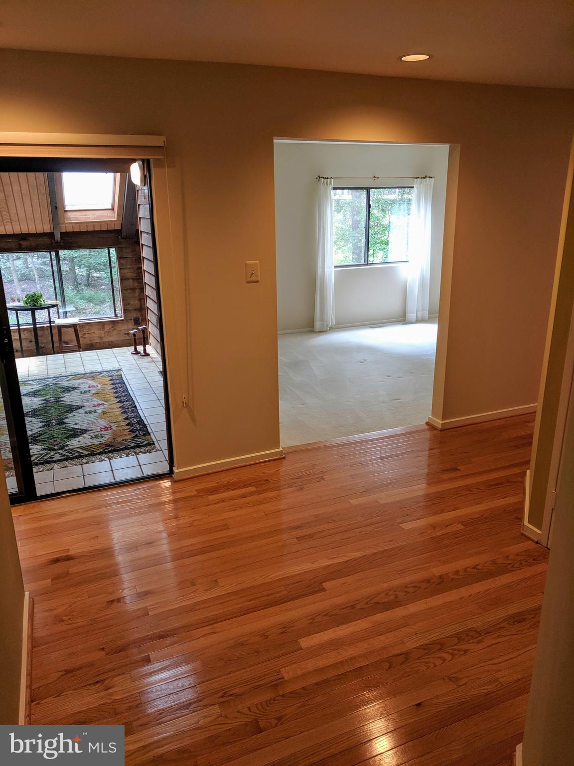 2272 Compass Point Lane Reston, VA 20191 - Photo 17 of 25 an empty room with wooden floor and windows