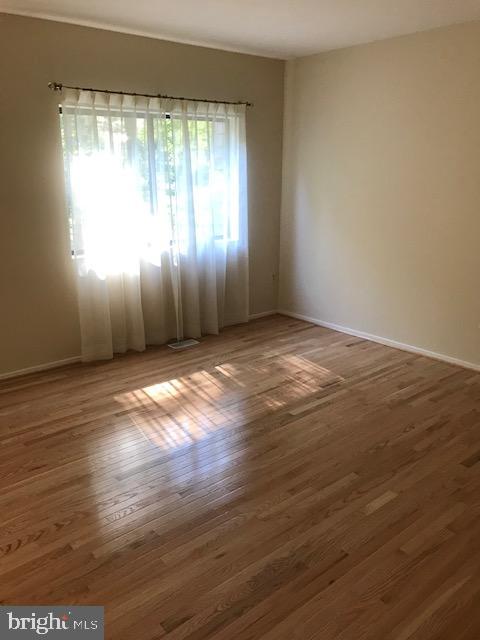 2272 Compass Point Lane Reston, VA 20191 - Photo 8 of 25 an empty room with wooden floor and windows
