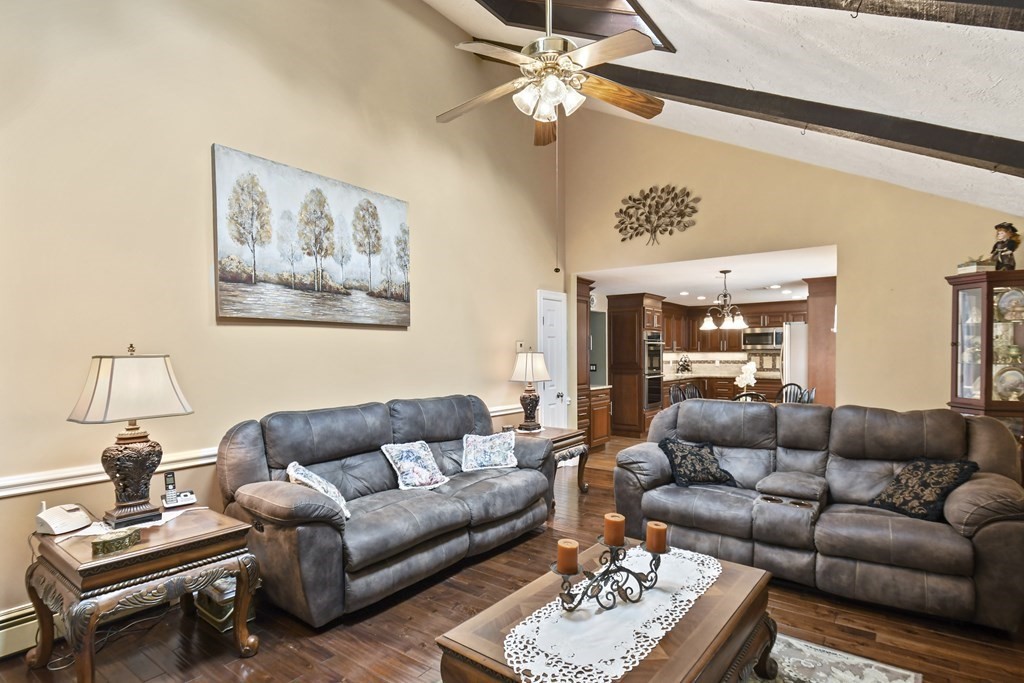 33 Old Farm Road Reading, MA 01867 - Photo 20 of 42 a living room with furniture a rug and a window