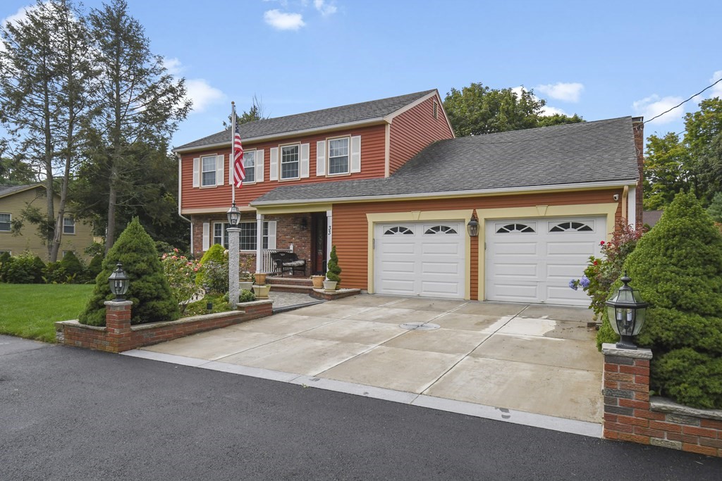 33 Old Farm Road Reading, MA 01867 - Photo 2 of 42 front view of a house with a yard
